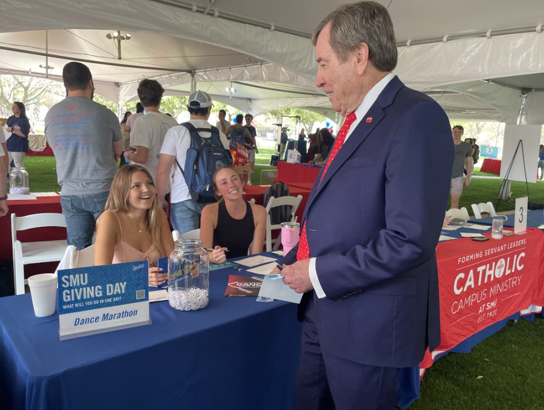 President Turner greets students at Giving Day. Turner will remain a member of SMU's community as President Emeritus. 